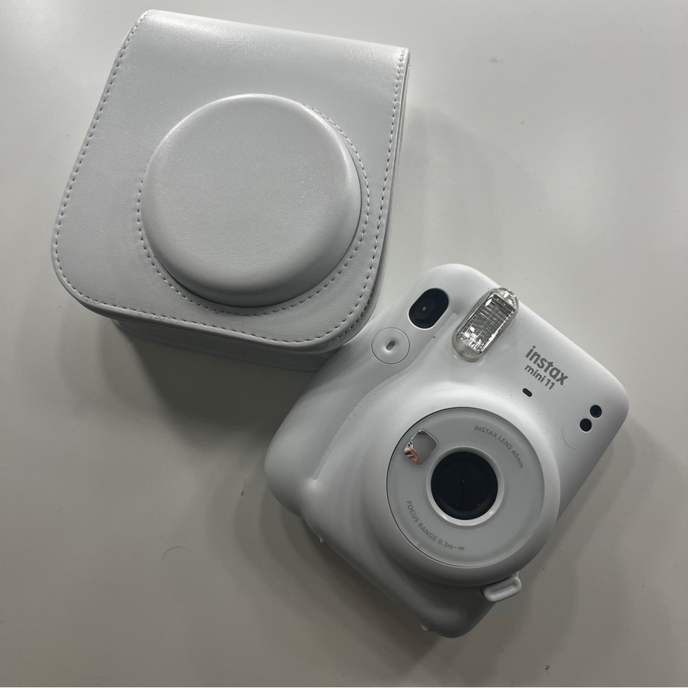 White Fujifilm Polaroid camera